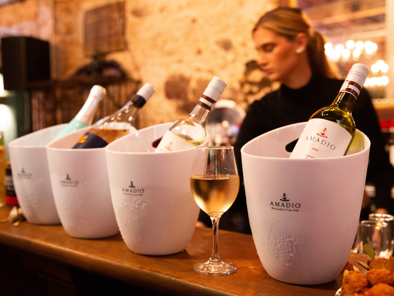 Image of wine buckets on  bar at event